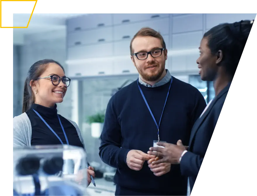 Male and female scientists engaging in a discussion in a modern laboratory setting